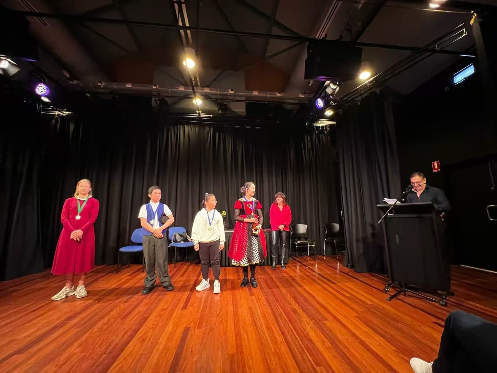 Students on stage during the results announcement at an eisteddfod