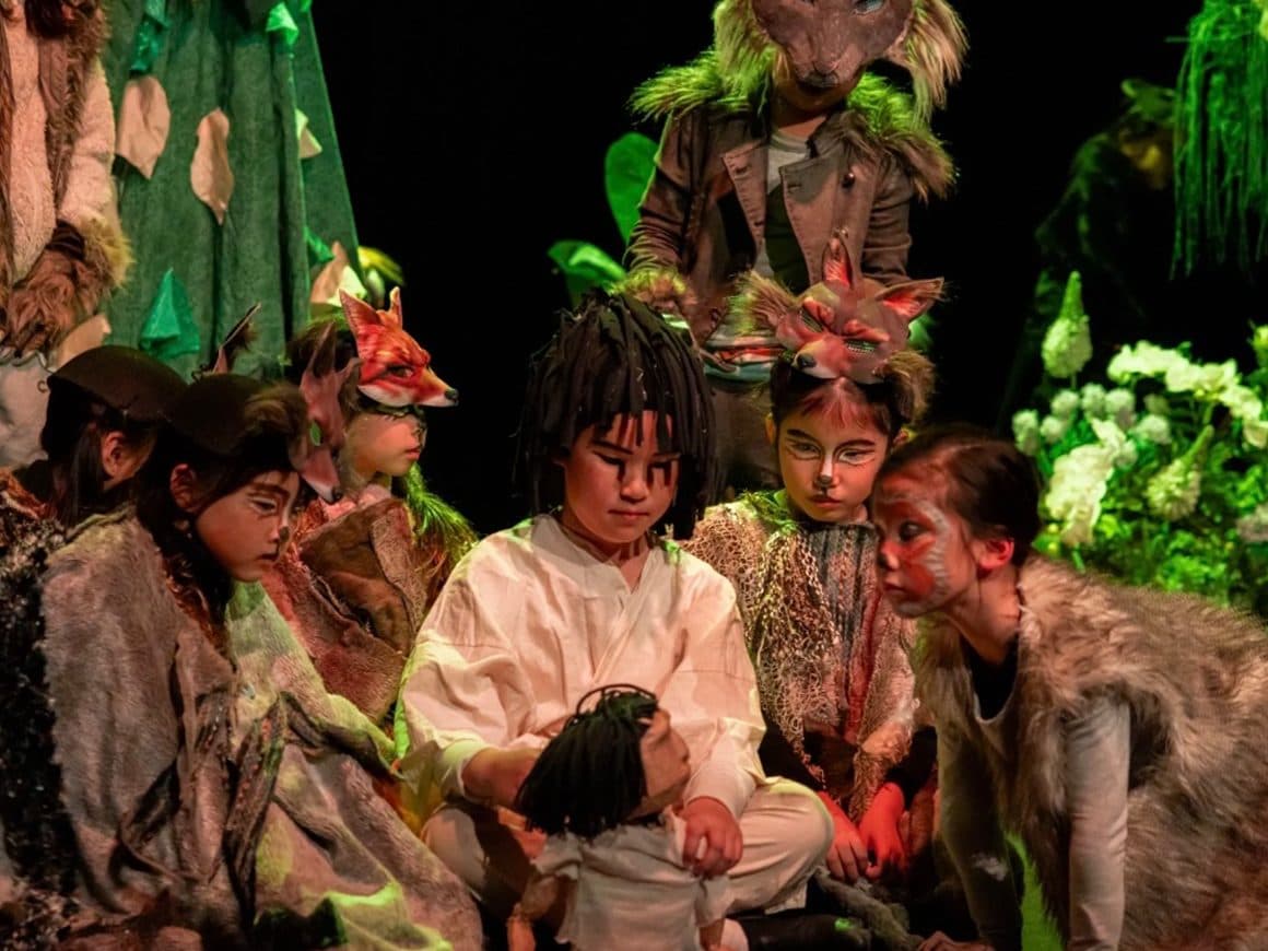 Students in animal costume and face paint in the annual production of The Jungle Book