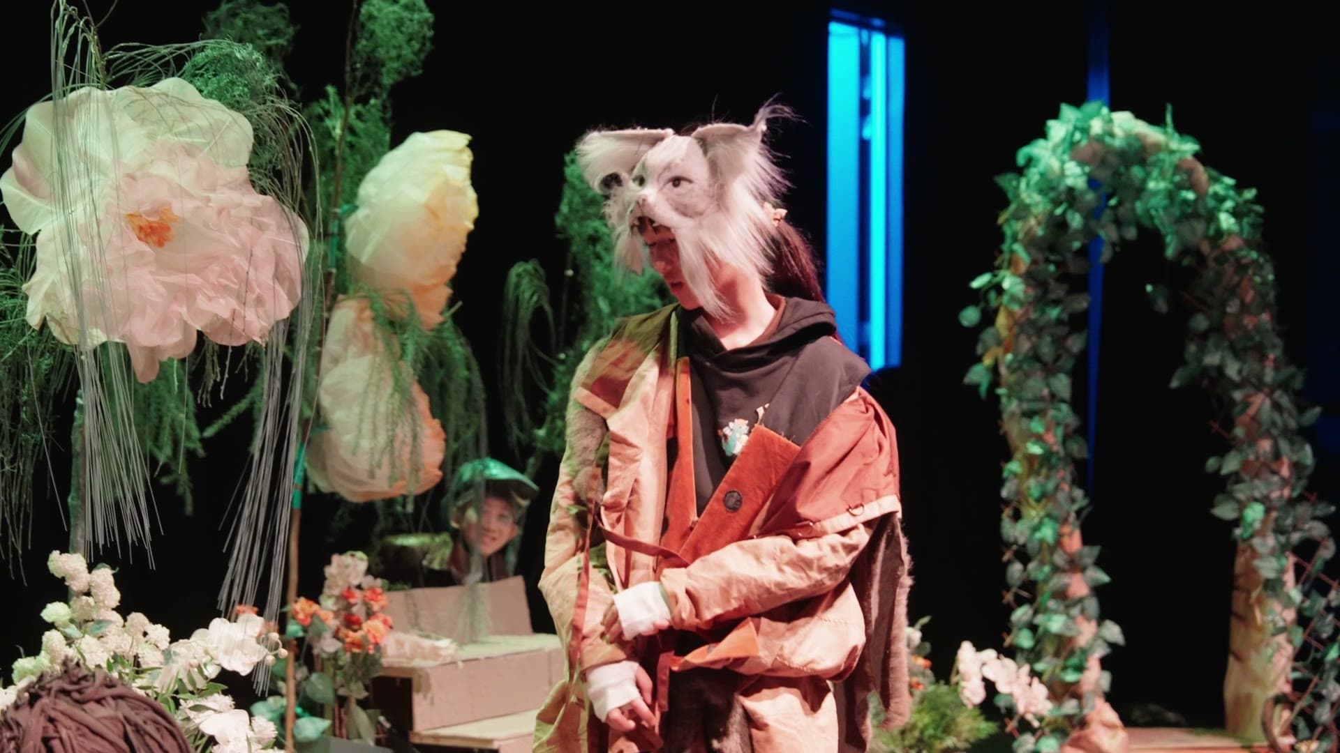 The cast of The Jungle Book on stage in animal costume and face paint